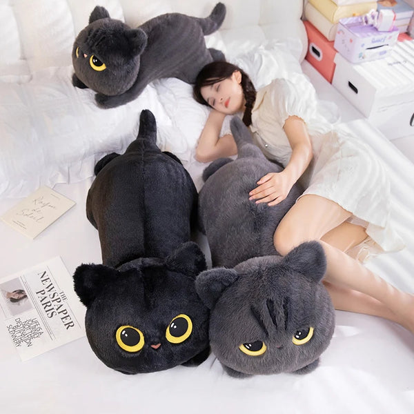 A cute soft pillow in the shape of a black cat