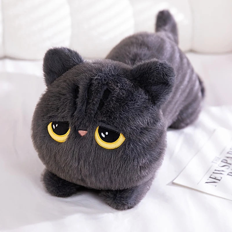 A cute soft pillow in the shape of a black cat